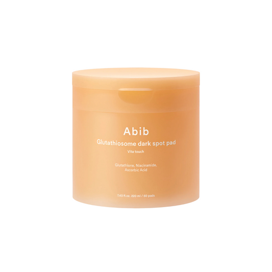 ABIB Glutathiosome Dark Spot Pad Vita Touch is a brightening toner pad designed to fade dark spots and even skin tone. Infused with Glutathione, Niacinamide, and Vitamin C derivatives, it helps improve dullness and pigmentation. Soothing ingredients like Panthenol, Allantoin, and Beta-Glucan calm the skin, while Ceramides and Lactic Acid support a smooth, hydrated complexion. Ideal for daily use to reveal clearer, more radiant skin.