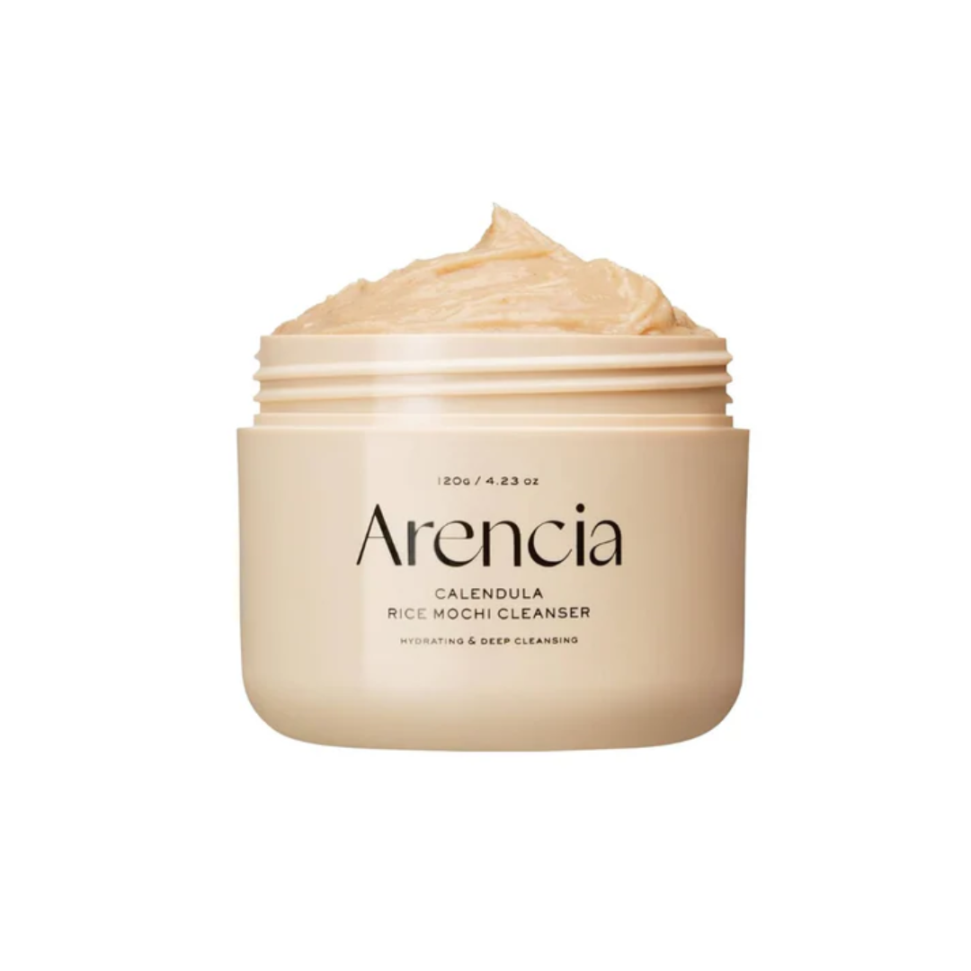 ARENCIA Calendula Rice Mochi Cleanser is a gentle exfoliating cleanser that smooths and refreshes the skin. Made with Rice Powder and Sweet Almond Seed Meal, it softly polishes away dead skin cells while cleansing impurities. Infused with Calendula, Witch Hazel, and Houttuynia Cordata Extracts, it calms irritation and helps control excess oil. With a unique mochi-like texture, this cleanser leaves the skin clean, balanced, and radiant. Suitable for all skin types, especially sensitive and combination skin.