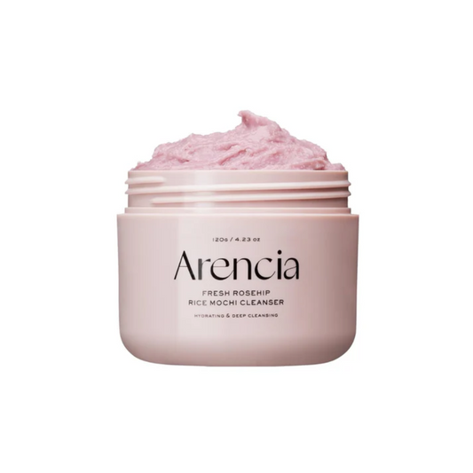 ARENCIA Fresh Rosehip Rice Mochi Cleanser is a soft, grainy cleanser that gently exfoliates while nourishing the skin. Formulated with Rice Powder and Sweet Almond Seed Meal, it helps remove dead skin cells and impurities for a smoother texture. Infused with Rosehip Extract, Apple Fiber, and Aloe Vera, it brightens, soothes, and hydrates, leaving skin refreshed and radiant. With its mochi-like texture, this cleanser provides a mild yet effective cleanse. Suitable for all skin types, especially dull and roug