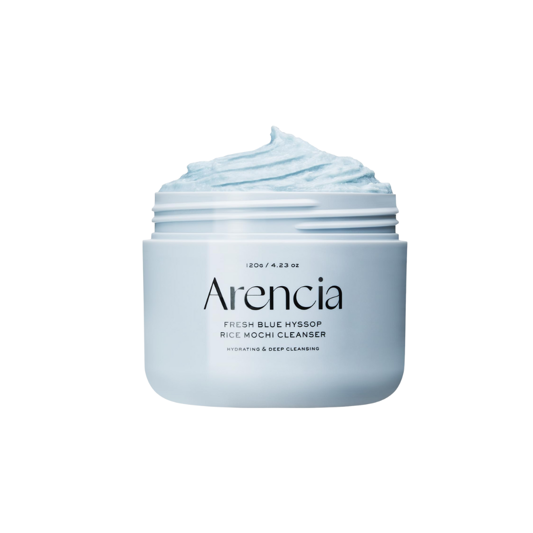 ARENCIA Fresh Royal Blue Hyssop Rice Mochi Cleanser is a gentle exfoliating cleanser that leaves skin feeling soft and refreshed. Formulated with Sweet Almond Seed Meal and Rice Powder, it provides mild physical exfoliation to slough off dead skin cells, while Kaolin Clay helps draw out impurities. Enriched with Glycerin, Camellia Sinensis Leaf Extract, and Hyssop Extract, this creamy cleanser hydrates and soothes the skin, making it suitable for daily use without stripping moisture. Ideal for those seeking
