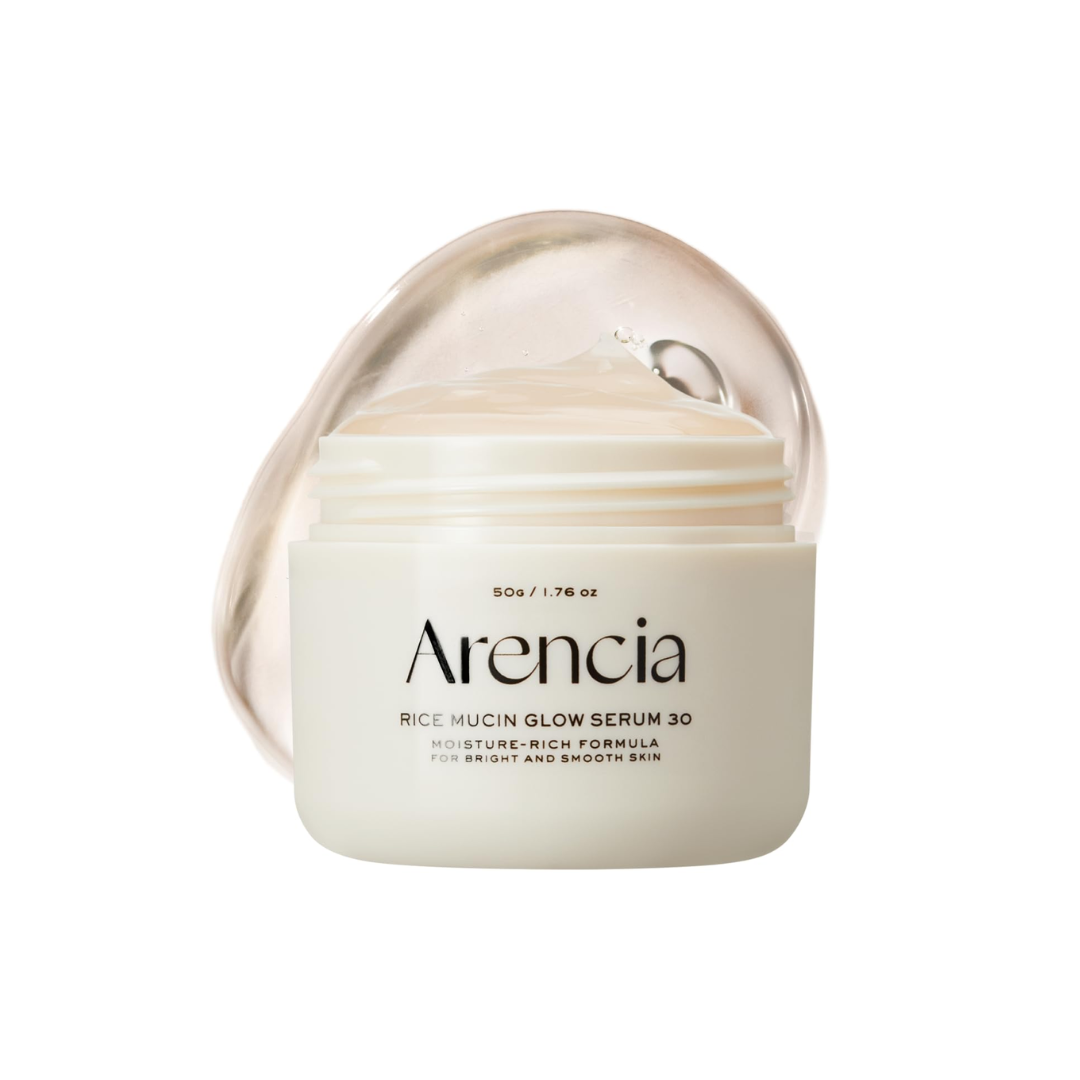 ARENCIA Rice Mucin Glow Serum 30 is a brightening and hydrating serum formulated with Rice Ferment Filtrate (Sake) to boost radiance and improve skin texture. Enriched with Niacinamide, Hyaluronic Acid, and Hydrolyzed Collagen, it deeply moisturizes, plumps, and smooths the skin. Retinal, Tranexamic Acid, and Vitamins help refine tone and support a healthy, glowing complexion. Its lightweight texture absorbs easily, leaving skin soft, luminous, and refreshed.
