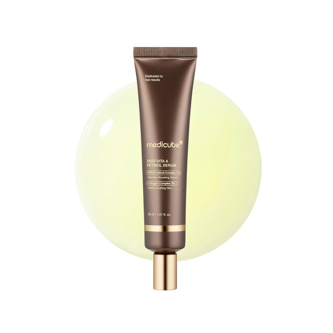 MEDICUBE Deep Vita A Retinol Serum is a multi-action anti-aging serum that helps smooth fine lines, even out skin tone, and improve texture. Formulated with a powerful blend of Retinol, Retinal, and Bakuchiol, it supports skin renewal while minimizing irritation. Enriched with Niacinamide, Panthenol, and Hyaluronic Acid, it hydrates and soothes the skin, making it ideal for those looking to brighten, firm, and revitalize their complexion.