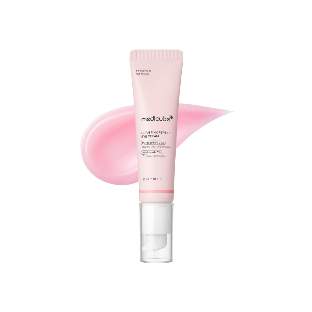 MEDICUBE PDRN Pink Peptide Eye Cream is a nourishing eye treatment that targets fine lines, puffiness, and dark circles. Infused with Sodium DNA (PDRN), Retinol, and a complex of Peptides, it helps revitalize tired under-eyes and improve skin elasticity. Niacinamide brightens, while Caffeine and Strawberry Extract reduce puffiness for a refreshed, youthful look. Perfect for delicate skin around the eyes.
