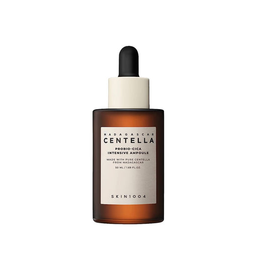 SKIN1004 Madagascar Centella Probio-Cica Intensive Ampoule is crafted to calm and revitalize the skin. It boasts a rich content of Centella Asiatica Extract and its ferment filtrate, renowned for their restorative and soothing effects. This potent ampoule also includes Panthenol, Hyaluronic Acid, and Ceramide to deeply moisturize and fortify the skin's barrier. Ingredients like Madecassic Acid and Asiaticoside work to improve skin texture and elasticity. Suitable for all skin types, it helps achieve a more