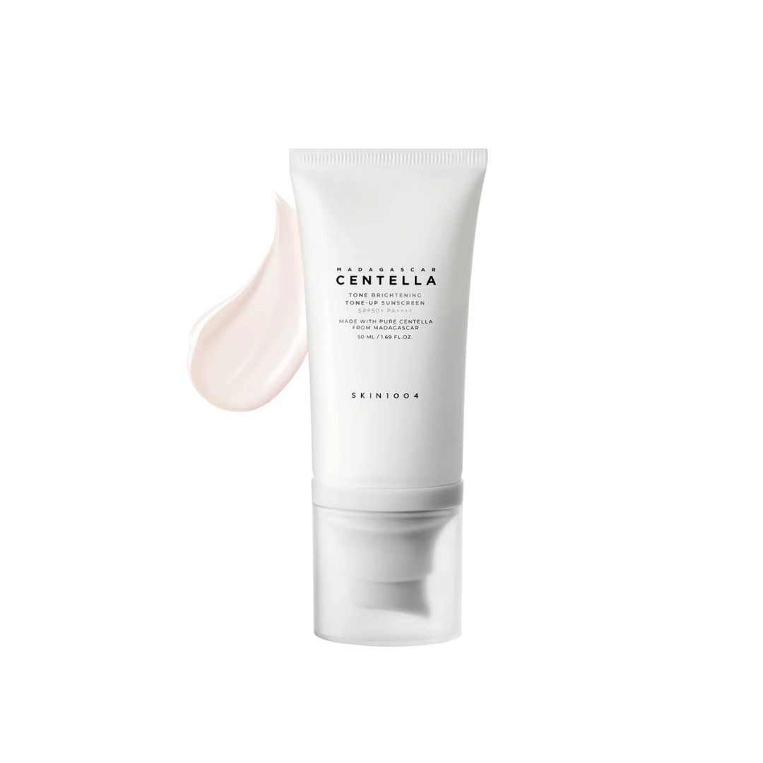 SKIN1004 Madagascar Centella Tone Brightening Tone Up Sunscreen is a lightweight, non-greasy sunscreen that offers broad-spectrum protection while instantly brightening the skin. Infused with Centella Asiatica Extract, Niacinamide, and Tranexamic Acid, it helps soothe, hydrate, and even out skin tone. With a soft tone-up effect, it leaves your skin looking fresh, radiant, and protected—perfect as the final step in your morning skincare routine.