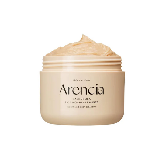 ARENCIA Calendula Rice Mochi Cleanser is a gentle exfoliating cleanser that smooths and refreshes the skin. Made with Rice Powder and Sweet Almond Seed Meal, it softly polishes away dead skin cells while cleansing impurities. Infused with Calendula, Witch Hazel, and Houttuynia Cordata Extracts, it calms irritation and helps control excess oil. With a unique mochi-like texture, this cleanser leaves the skin clean, balanced, and radiant. Suitable for all skin types, especially sensitive and combination skin.