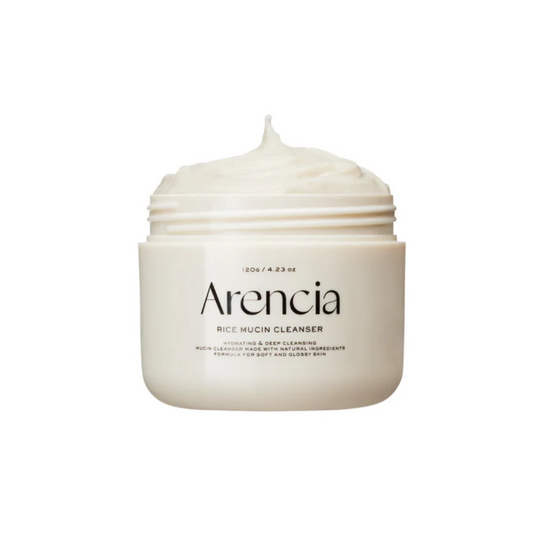ARENCIA Rice Mucin Cleanser is a gentle foaming cleanser that removes impurities while keeping the skin hydrated and soft. Formulated with Rice Powder, Rice Extract, and Rice Bran Extract, it helps brighten and smooth the complexion. Enriched with Snail Secretion Filtrate, Cocoa Seed Extract, and Glycerin, it nourishes, soothes, and supports skin barrier health. With a creamy texture that lathers into a soft foam, this cleanser leaves skin fresh, clean, and radiant without dryness. Suitable for all skin typ
