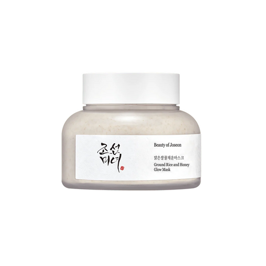 BEAUTY OF JOSEON Ground Rice and Honey Glow Mask is a nourishing wash-off mask that gently exfoliates and brightens the skin. Infused with Honey and Ground Rice, it removes dead skin cells, smooths texture, and boosts radiance. With added Kaolin Clay and Rice Extracts, it helps refine pores while leaving the skin soft, hydrated, and glowing. Ideal for dull or rough skin in need of a gentle glow boost.