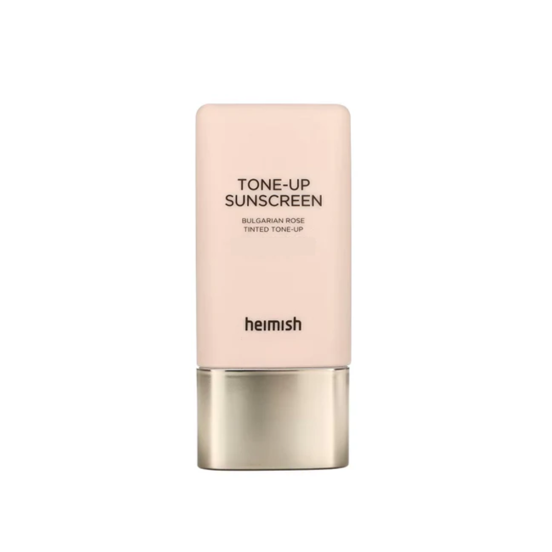 HEIMISH Bulgarian Rose Tinted Tone-Up Sunscreen enhances your natural glow with a subtle rosy tint while brightening and evening out your skin tone. Infused with nourishing ingredients like rosa damascena flower water and rosa canina fruit oil, it hydrates and soothes your skin for a soft, radiant finish. The lightweight, smooth texture ensures easy application without feeling heavy or sticky, making it ideal for daily use. Enhanced with botanical extracts like hibiscus, viola tricolor, and crataegus monogy