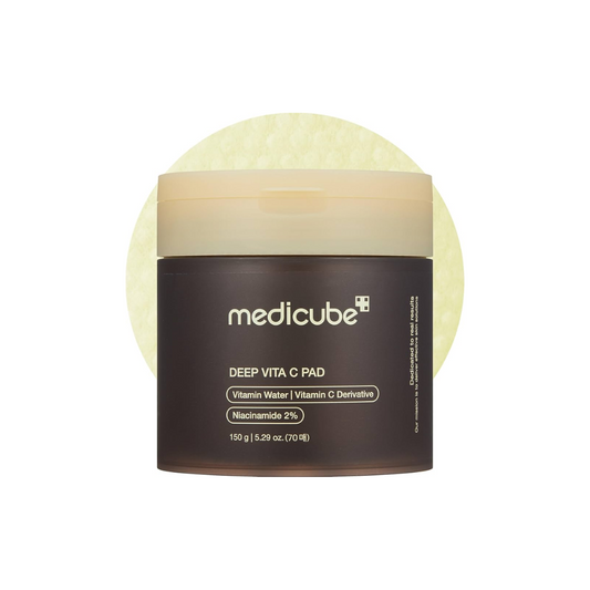 MEDICUBE Deep Vita C Pad is a brightening and revitalizing toner pad soaked in Vitamin C, Niacinamide, and Sea Buckthorn Water to improve skin tone and boost radiance. Infused with soothing ingredients like Panthenol, Allantoin, and Hyaluronic Acid, it gently hydrates and refreshes the skin while helping to fade dark spots and dullness. Ideal for daily use to reveal a smoother, more glowing complexion.