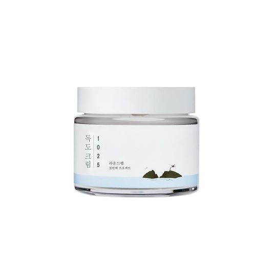 ROUND LAB 1025 Dokdo Cream is a nourishing moisturizer that helps hydrate, calm, and protect the skin. Formulated with deep sea water from Ulleungdo Island and a blend of Ceramides and Hyaluronic Acid, it strengthens the skin barrier and locks in moisture. Soothing ingredients like Panthenol, Allantoin, and Beta-Glucan help reduce redness and support a healthy, balanced complexion—perfect for dry or sensitive skin.