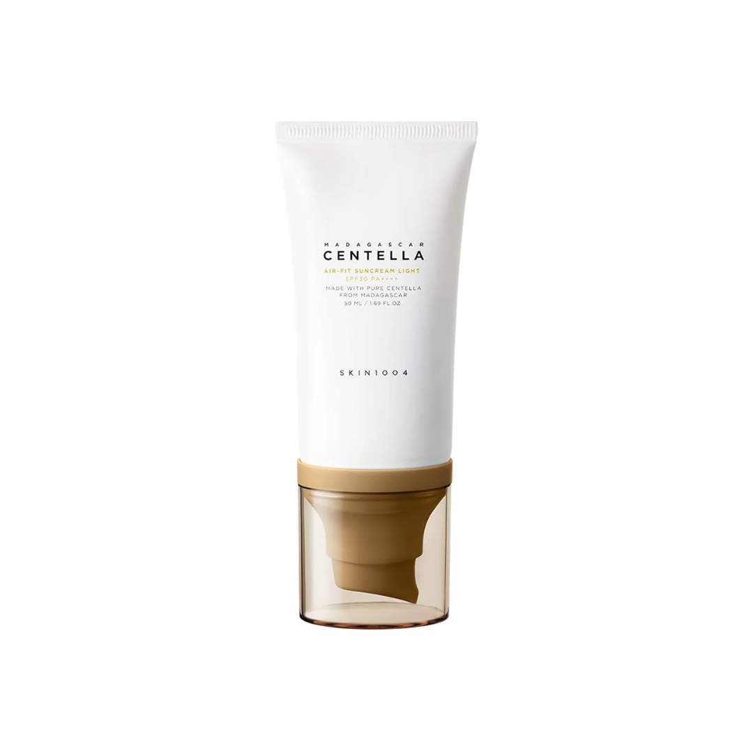 SKIN1004 Madagascar Centella Air-Fit Suncream Light offers SPF protection with a lightweight, non-greasy finish. Enriched with Centella Asiatica Extract (29,400 ppm), it soothes and calms irritated skin while Niacinamide brightens and improves tone. Infused with Houttuynia Cordata and Portulaca Oleracea Extracts, it hydrates and strengthens the skin barrier. Perfect for daily use, this gentle formula leaves your skin smooth, refreshed, and protected.