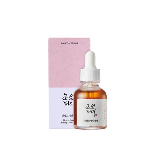 BEAUTY OF JOSEON Revive Serum: Ginseng + Snail Mucin is a nourishing anti-aging serum that helps restore vitality and elasticity to tired skin. Infused with Ginseng Root Water and Extract, it revitalizes and improves circulation, while Snail Mucin deeply hydrates and supports skin repair. Enriched with Niacinamide, Hyaluronic Acid, and Centella Asiatica, it brightens, smooths, and strengthens the skin barrier for a healthier, youthful glow.