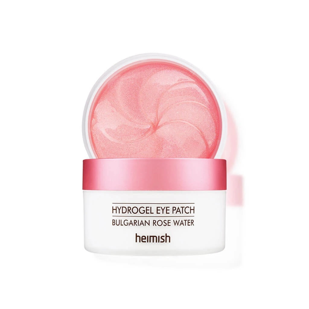 HEIMISH Bulgarian Rose Water Hydrogel Eye Patch is a revitalizing treatment that brightens and refreshes the under-eye area. Infused with real Bulgarian Rose Water and Niacinamide, these hydrogel patches hydrate and illuminate the skin while reducing the appearance of dark circles. Key natural extracts like Witch Hazel, Centella Asiatica, and Lotus Flower soothe and calm puffiness. The luxurious formula also contains Sodium Hyaluronate to deeply moisturize, leaving the under-eye area smooth and firm. Ideal 